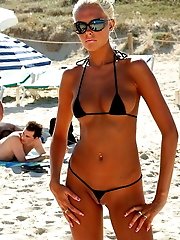 23 pictures - A bikini girl going topless on the La Joya Nude
