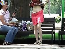 2 movies - Real voyeur upskirt of a hot girl trying on her new skirt right in the park