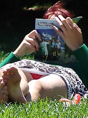 12 pictures - Crossed leg upskirts, nice redhead caught by cam
