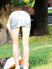 12 pictures - Hot brunette shows stockings up skirt