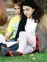 12 pictures - Hot brunette shows stockings up skirt