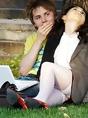 12 pictures - Hot brunette shows stockings up skirt