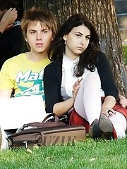 12 pictures - Hot brunette shows stockings up skirt