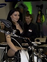 15 pictures - Brunette on the bike has her boobs seen under top