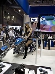15 pictures - Brunette on the bike has her boobs seen under top