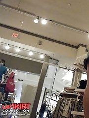 12 pictures - Peek up skirt, of young brunette in a shop