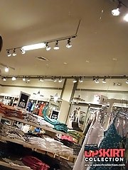 12 pictures - Peek up skirt, of young brunette in a shop