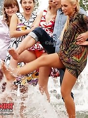 12 pictures - Hot upskirt girls have fun by fountain