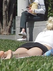 12 pictures - Cute blonde in black denim mini. Hot upskirt