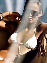 12 pictures - Bare titted models wear nothing but small panties