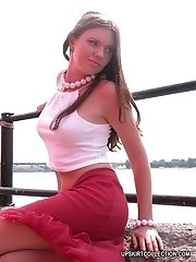 15 pictures - Babe with bare tits gets her pussy shot close up outdoors