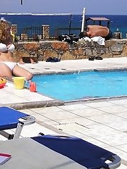 12 pictures - Slutty chicks wearing tiny swimsuits