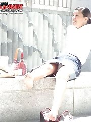 12 pictures - Young brunette caught sitting. Candid upskirt