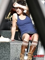 12 pictures - Female upskirt oops. Pink panties up her mini skirt