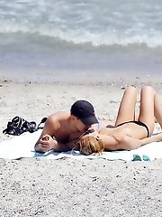 12 pictures - Out of sexy bikini girl masturbates