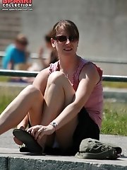 12 pictures - Cute babe in mini peeked. Real street upskirt