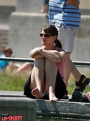 12 pictures - Cute babe in mini peeked. Real street upskirt