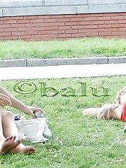 12 pictures - Cute upskirt girls relax in the park