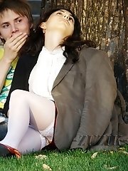 12 pictures - Hot brunette shows stockings up skirt