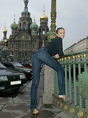 15 pictures - Sexy photo set featuring slim doll in jeans in the street