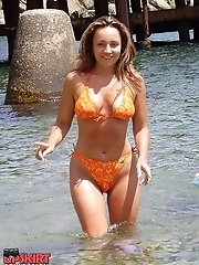 12 pictures - Sexy bikini teens don?t mind posing on the beach